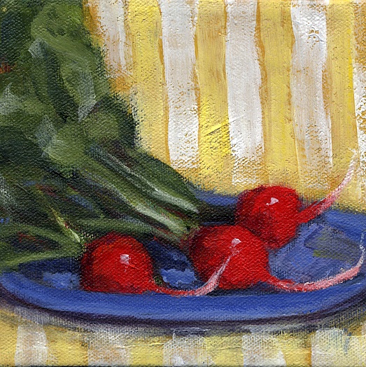 3 radishes from garden on blue plate