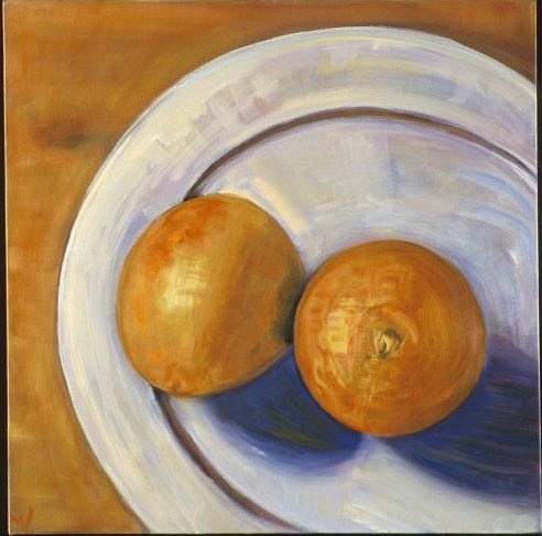oranges on a plate from above