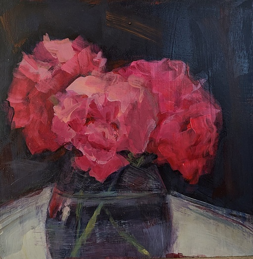 pink hydrangeas in glass vase blue backgrounds