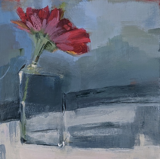 red gerbera daisy class vase gray blue green background