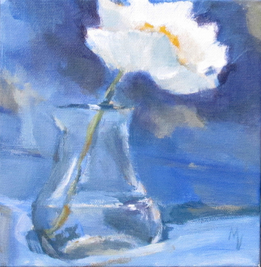 one white poppy in glass vase