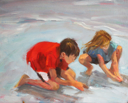 Ethan and Elena building castles in the surf