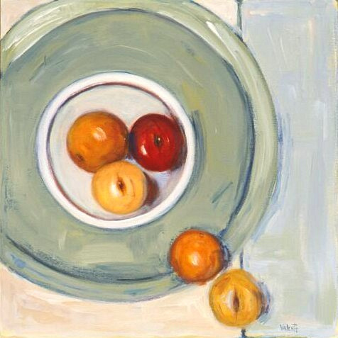 aerial view of white bowl on teal plate with fruit