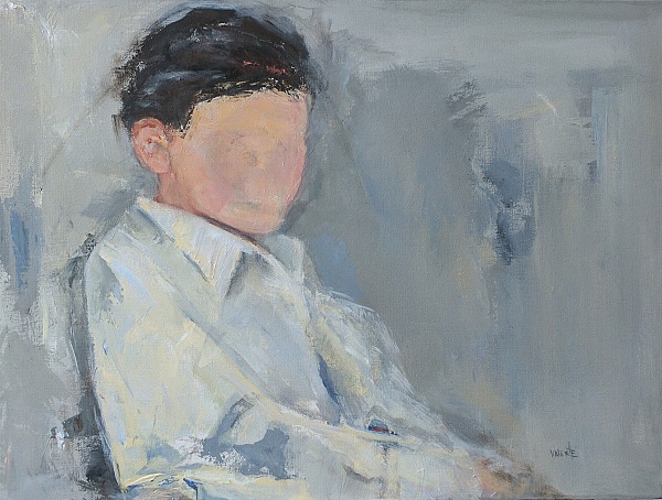 Boy sitting looking to the side